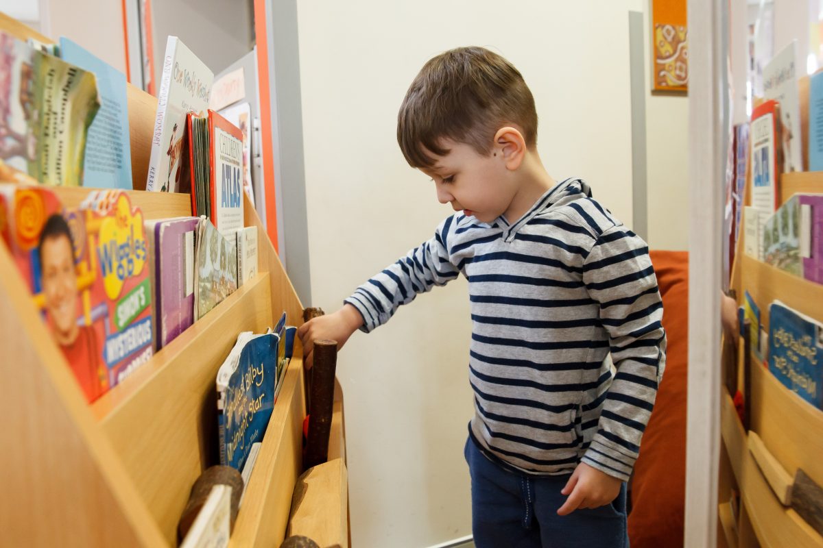 child browsing books