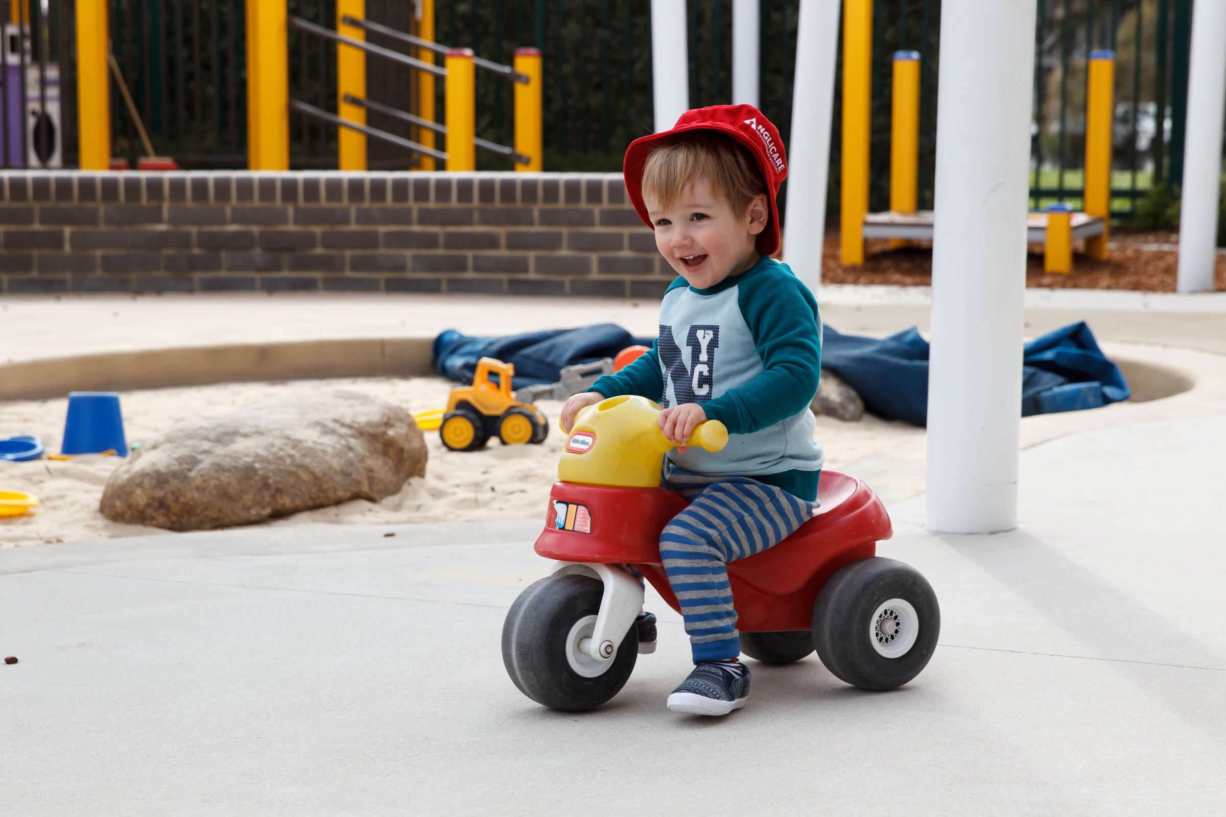 toddler on plastic trike