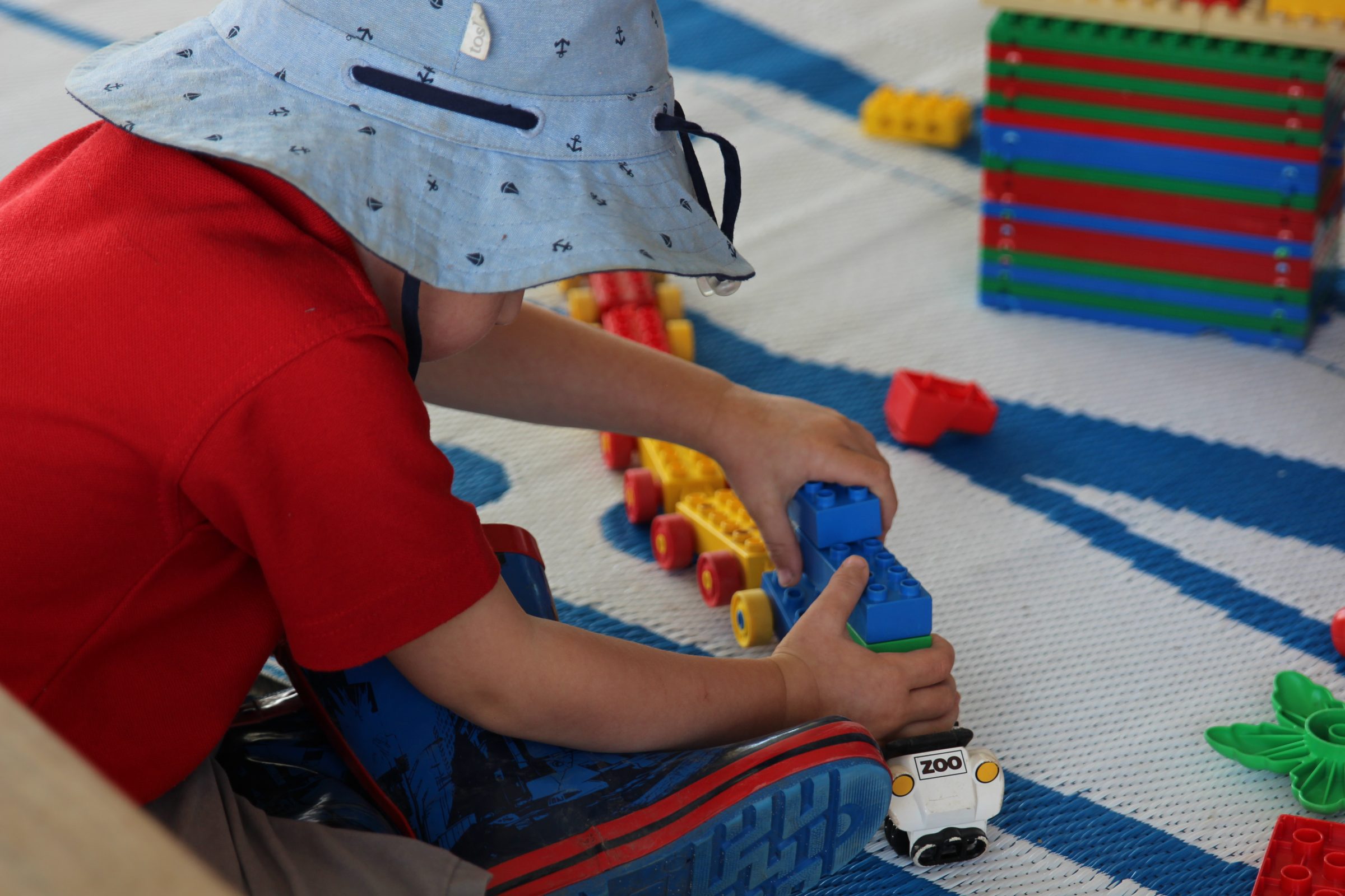 Preschooler playing with toy train