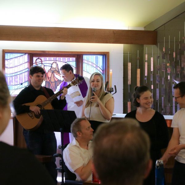 Embracing Ministries and Anglicare Disability clients leading carols singing